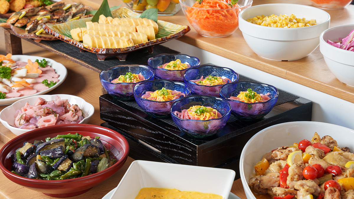 A buffet spread featuring ume udon as the centerpiece