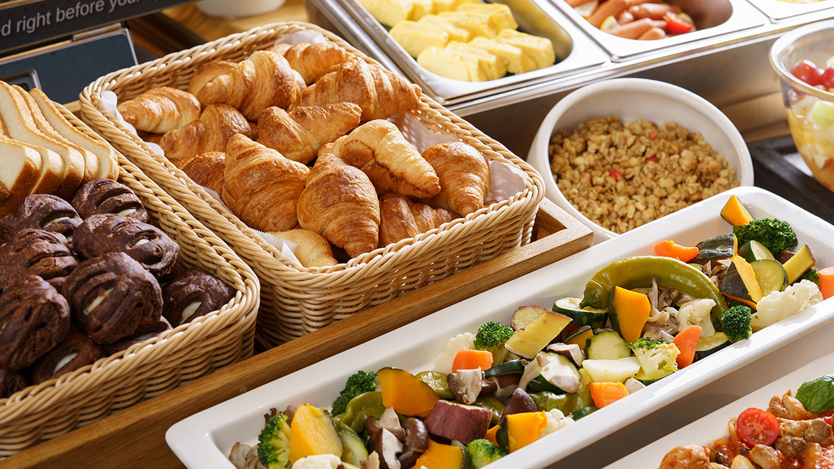 Bread, steamed vegetables, and granola