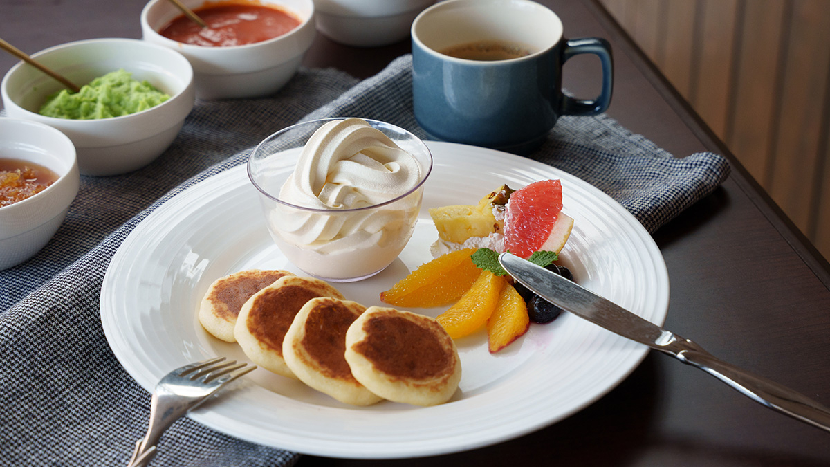 Pancakes and soft serve arranged on a plate
