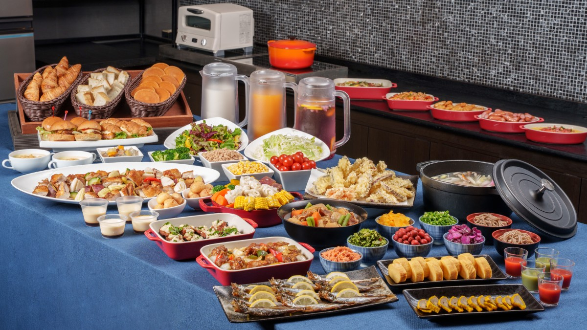 A buffet table filled with a wide variety of dishes