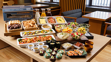 Breakfast buffet with a variety of dishes displayed