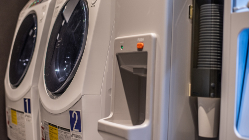 Close-up view of ice machine and laundromat
